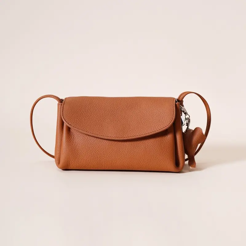 Danoz Fashion Elephant-Charm Crossbody Bag – Compact Genuine Leather Flap Shoulder Purse (Golden Brown) 1